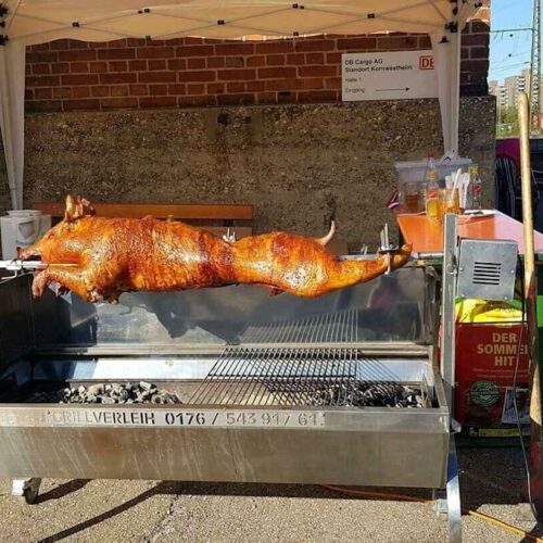 Spanferkelgrill mieten - Edelstahl-Grill mit Motor und Rollen